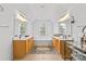 Bright bathroom with dual sinks, a soaking tub, and large windows at 3213 Strawberry Rd, Matthews, NC 28104
