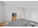 Bedroom featuring neutral walls, carpet and a television on a wooden stand at 3213 Strawberry Rd, Matthews, NC 28104