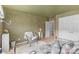 Cozy bedroom featuring a chair, area rug, and painted green walls at 3213 Strawberry Rd, Matthews, NC 28104