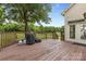 Spacious wooden deck perfect for outdoor relaxation and grilling in a private backyard setting at 3213 Strawberry Rd, Matthews, NC 28104