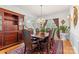 Sophisticated dining room showcasing a wooden table, elegant chandelier, and a decorative hutch at 3213 Strawberry Rd, Matthews, NC 28104