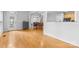 Bright foyer featuring hardwood floors with views into the kitchen and living room at 3213 Strawberry Rd, Matthews, NC 28104