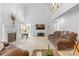 Bright living room boasts cathedral windows, a fireplace, comfortable furniture, and a large TV at 3213 Strawberry Rd, Matthews, NC 28104