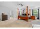 Spacious main bedroom with carpet, two windows and views into the main bath at 3213 Strawberry Rd, Matthews, NC 28104