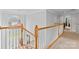 Bright hallway with a staircase and neutral carpeting and a large palladian window at 3213 Strawberry Rd, Matthews, NC 28104