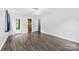 Spacious bedroom features hardwood floors, a ceiling fan and multiple access doors at 328 Pamela St, Gastonia, NC 28054
