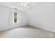 Bright bedroom featuring a ceiling fan, neutral carpet, and a window with white curtains at 328 Pamela St, Gastonia, NC 28054