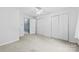 Bedroom features a neutral carpet, closet, and an entry to the next room at 328 Pamela St, Gastonia, NC 28054