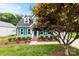 Beautiful two-story home with a landscaped front yard, mature tree, and classic architectural details at 328 Pamela St, Gastonia, NC 28054