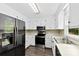 Well-equipped kitchen with stainless steel appliances, tile backsplash, and bright lighting fixtures at 328 Pamela St, Gastonia, NC 28054