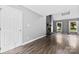 Comfortable living room featuring hardwood floors, a striking fireplace, and ample natural light from large windows at 328 Pamela St, Gastonia, NC 28054
