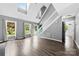 Inviting living room with hardwood floors, vaulted ceilings, and an abundance of natural light through large windows at 328 Pamela St, Gastonia, NC 28054