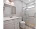 Modern bathroom with a glass-enclosed shower, vanity, and updated fixtures at 3351 Streamside Dr, Davidson, NC 28036