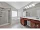 This is a spacious bathroom featuring a tub, shower and double vanity with great lighting at 3351 Streamside Dr, Davidson, NC 28036