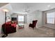 This bedroom features plush carpeting, a ceiling fan and lots of space to relax and unwind at 3351 Streamside Dr, Davidson, NC 28036
