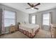 This is a cozy bedroom with soft carpet, lots of natural light, and neutral walls at 3351 Streamside Dr, Davidson, NC 28036