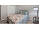 Cozy bedroom with a comfortable bed, soft lighting, and a closet at 3351 Streamside Dr, Davidson, NC 28036