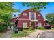 Charming clubhouse with a barn-like design, manicured landscaping, and inviting pathway at 3351 Streamside Dr, Davidson, NC 28036