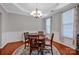 Elegant dining room with hardwood floors, chandelier, and ample natural light for memorable dinners at 3351 Streamside Dr, Davidson, NC 28036