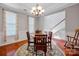 Charming dining room with a round table, decorative rug, and a seamless flow to other living spaces at 3351 Streamside Dr, Davidson, NC 28036
