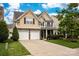 Charming two-story home features a landscaped front yard, two-car garage, and inviting curb appeal at 3351 Streamside Dr, Davidson, NC 28036