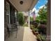 Cozy front porch with seating, perfect for enjoying the landscaped garden and neighborhood views at 3351 Streamside Dr, Davidson, NC 28036