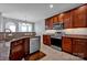 Modern kitchen featuring stainless steel appliances, granite counters, and ample cabinet space at 3351 Streamside Dr, Davidson, NC 28036