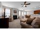 Open-concept living area with fireplace, comfortable furniture, and seamless flow to dining at 3351 Streamside Dr, Davidson, NC 28036