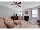Spacious living room featuring a fireplace, plush seating, TV, and large windows at 3351 Streamside Dr, Davidson, NC 28036