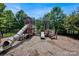 Well-maintained playground with multiple play structures, slides, and a soft landing surface at 3351 Streamside Dr, Davidson, NC 28036