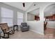 Inviting sunroom features large windows, a ceiling fan, and comfortable seating, perfect for relaxation at 3351 Streamside Dr, Davidson, NC 28036