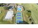 Overhead shot of the community featuring tennis courts, pool, and clubhouse with green surroundings at 3441 Club Ridge Ct, Gastonia, NC 28056
