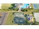 Aerial view showcasing the community pool, clubhouse, tennis courts, and well-maintained grounds at 3441 Club Ridge Ct, Gastonia, NC 28056