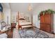 Bedroom boasts a four-poster bed, oriental rug, and decorative accents at 3441 Club Ridge Ct, Gastonia, NC 28056