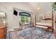 Bedroom showcases a four-poster bed, charming window nook, and elegant decor at 3441 Club Ridge Ct, Gastonia, NC 28056