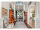 Inviting foyer with hardwood floors, elegant decor, and views into the living room and kitchen at 3441 Club Ridge Ct, Gastonia, NC 28056