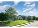 Well-maintained front yard with lush green lawn, mature trees, and attractive landscaping at 3441 Club Ridge Ct, Gastonia, NC 28056