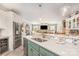 Open-concept kitchen with a breakfast bar, stainless steel appliances, and views into the living area at 3441 Club Ridge Ct, Gastonia, NC 28056