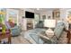 Comfortable living room featuring a stone fireplace, hardwood floors, and stylish furnishings at 3441 Club Ridge Ct, Gastonia, NC 28056