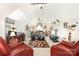Spacious living room/entertainment area features a vaulted ceiling, comfortable seating, and stylish decor at 3441 Club Ridge Ct, Gastonia, NC 28056