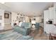 Cozy living room with plush seating and hardwood floors seamlessly connected to the kitchen area at 3441 Club Ridge Ct, Gastonia, NC 28056