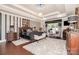 Opulent main bedroom featuring tray ceilings, modern black and white decor and a sitting area with armchairs at 3441 Club Ridge Ct, Gastonia, NC 28056