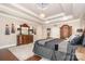 Elegant main bedroom featuring a decorative ceiling, chandelier, and dark wood furniture at 3441 Club Ridge Ct, Gastonia, NC 28056