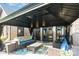 Covered patio area with comfortable seating and elegant outdoor decor at 3441 Club Ridge Ct, Gastonia, NC 28056