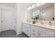 Elegant bathroom with double vanity, modern fixtures, and hexagon patterned tile floor at 36140 Greg Norman Dr # 1003, Lancaster, SC 29720