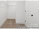 Walk-in closet offers ample storage with wire shelving and neutral carpeting at 36140 Greg Norman Dr # 1003, Lancaster, SC 29720