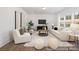 Sunlit living room featuring modern furnishings, a neutral color palette, and large windows at 36140 Greg Norman Dr # 1003, Lancaster, SC 29720