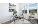 Bright office space with modern glass desk, comfortable seating, and a view of the outdoors at 36140 Greg Norman Dr # 1003, Lancaster, SC 29720