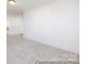 Spacious room with neutral carpet and fresh, white walls and trim at 36140 Greg Norman Dr # 1003, Lancaster, SC 29720