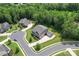 Aerial view of a large home with green lawn, circular drive, and mature trees in a suburban setting at 4008 Pinot Way, Fort Mill, SC 29707